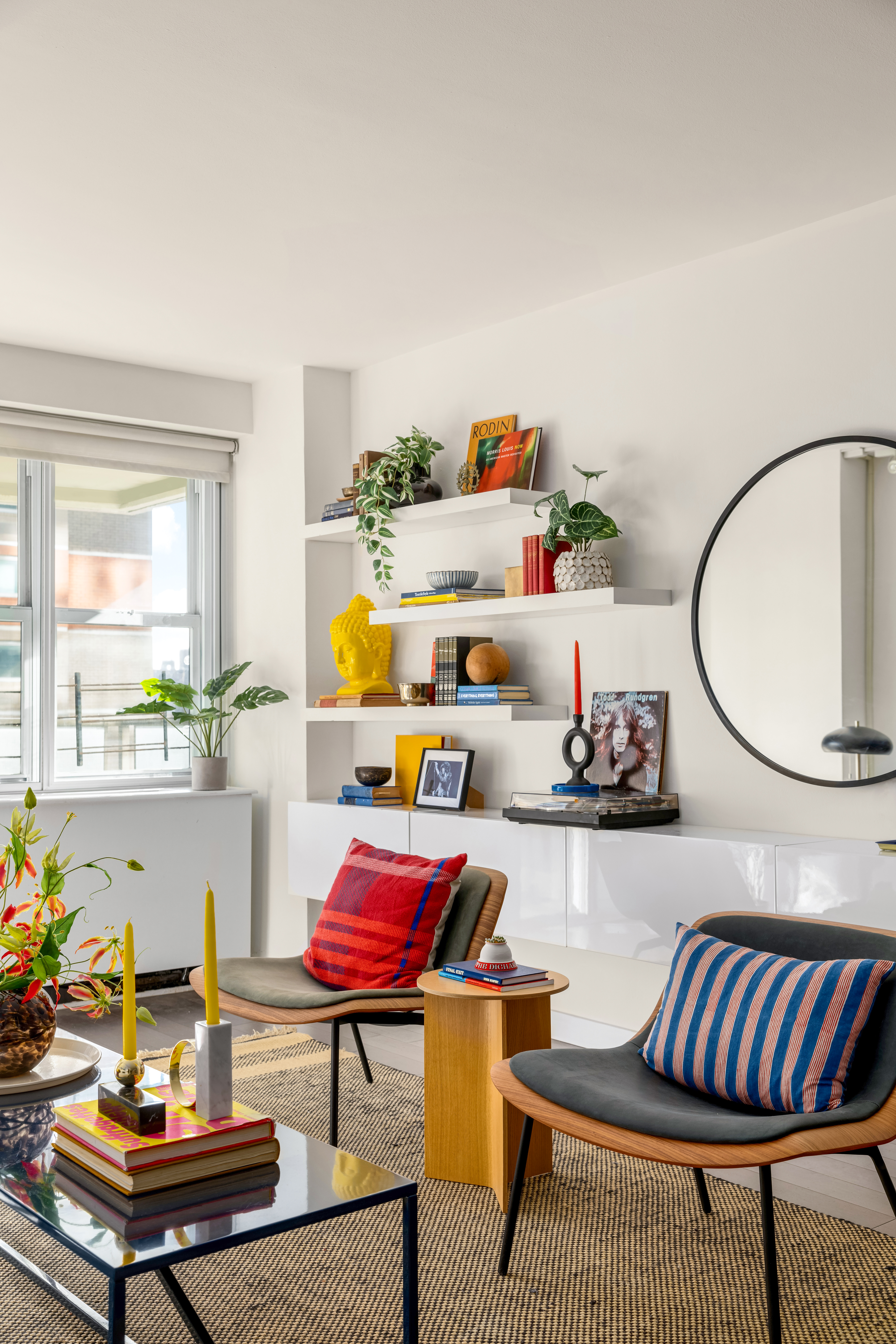 115 East 9th Street, Unit 8E Manhattan, NY 10003 - Photo 3 of 16 a living room with furniture and a potted plant