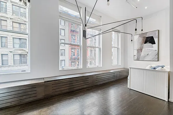 a bathroom with double vanity and a bathtub