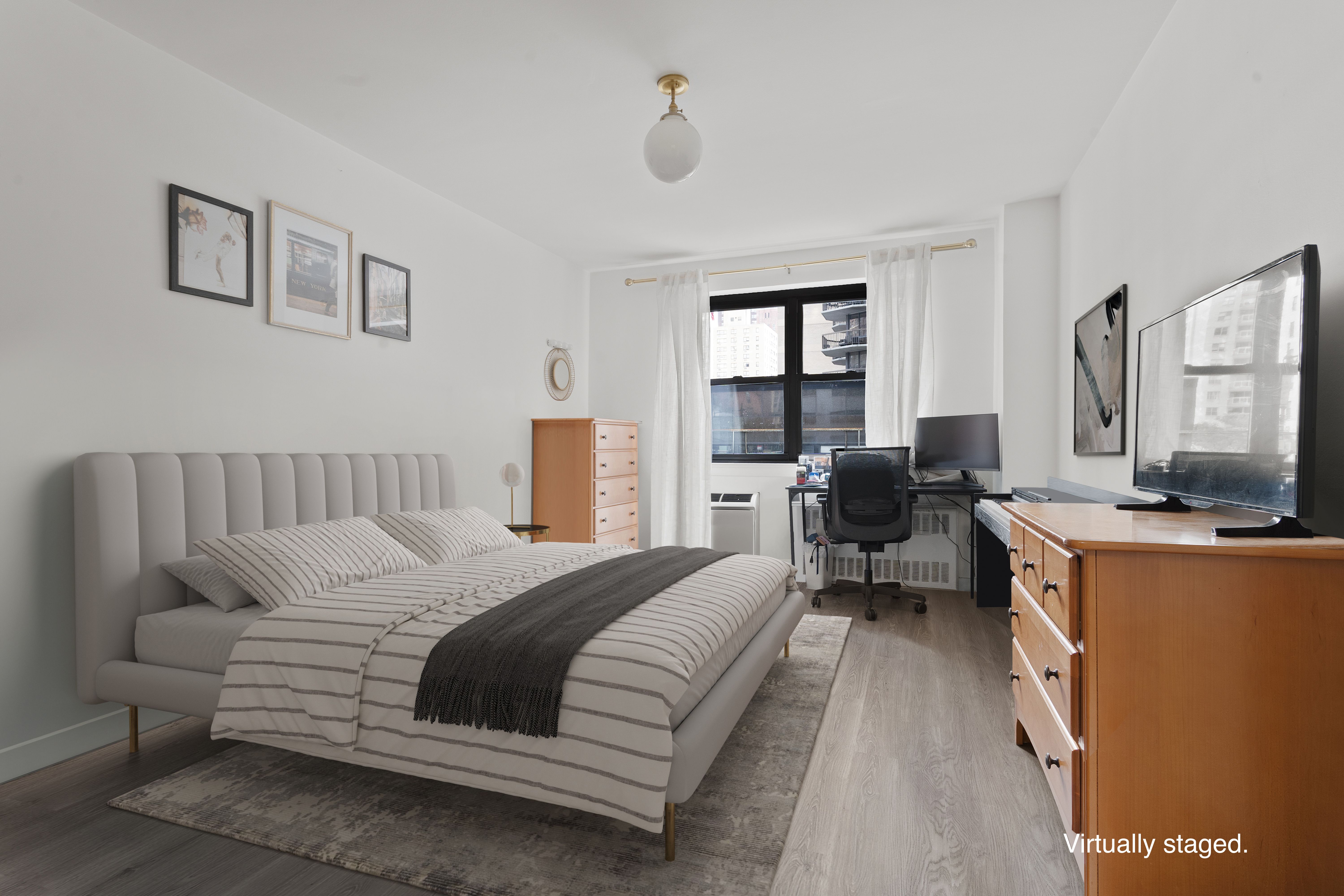 357 East 57th Street, Unit 2E Manhattan, NY 10022 - Photo 7 of 15 a bedroom with a bed couch and a window