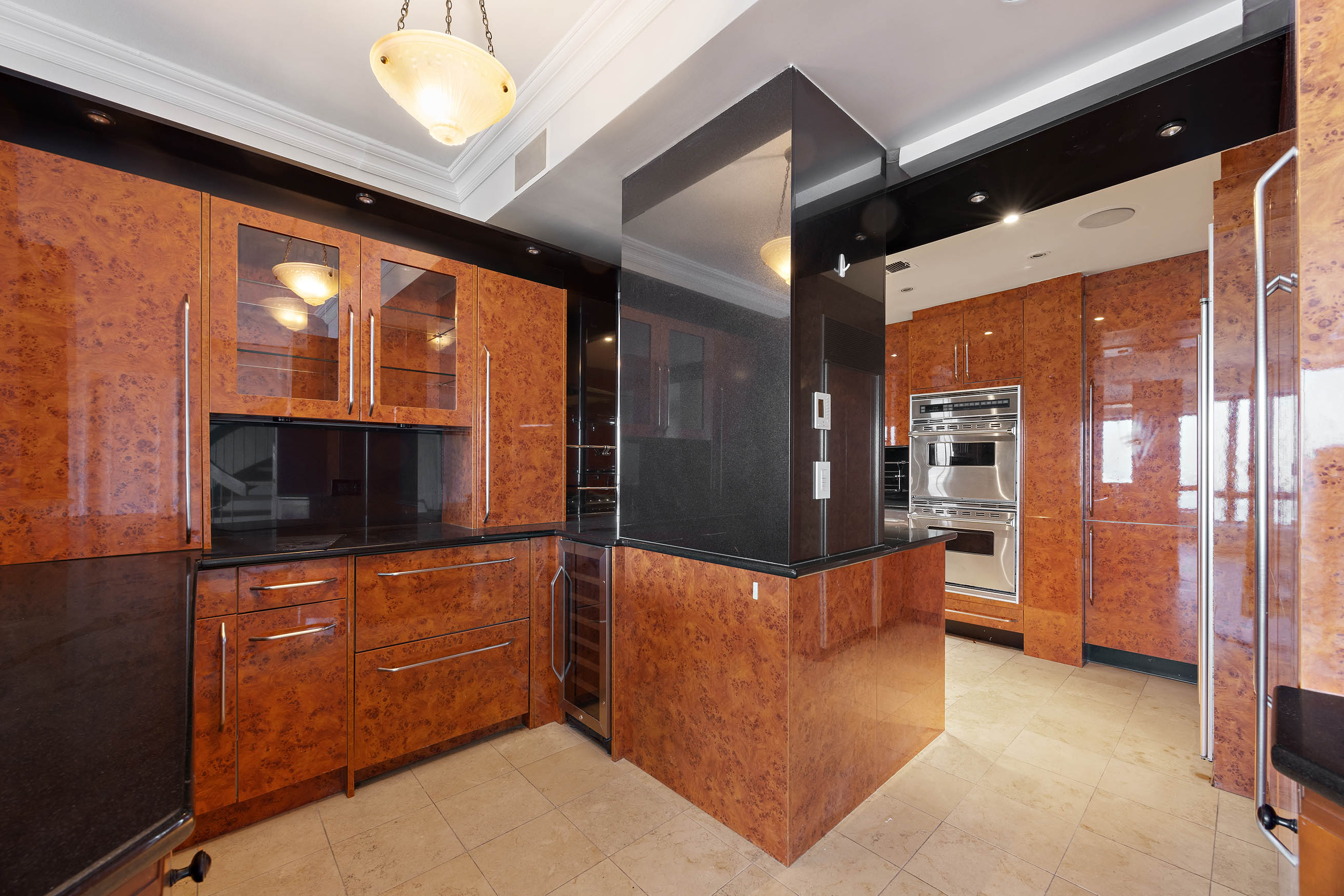 530 East 76th Street, Unit PH36/37E Manhattan, NY 10021 - Photo 7 of 29 a kitchen with stainless steel appliances a counter top space and cabinets