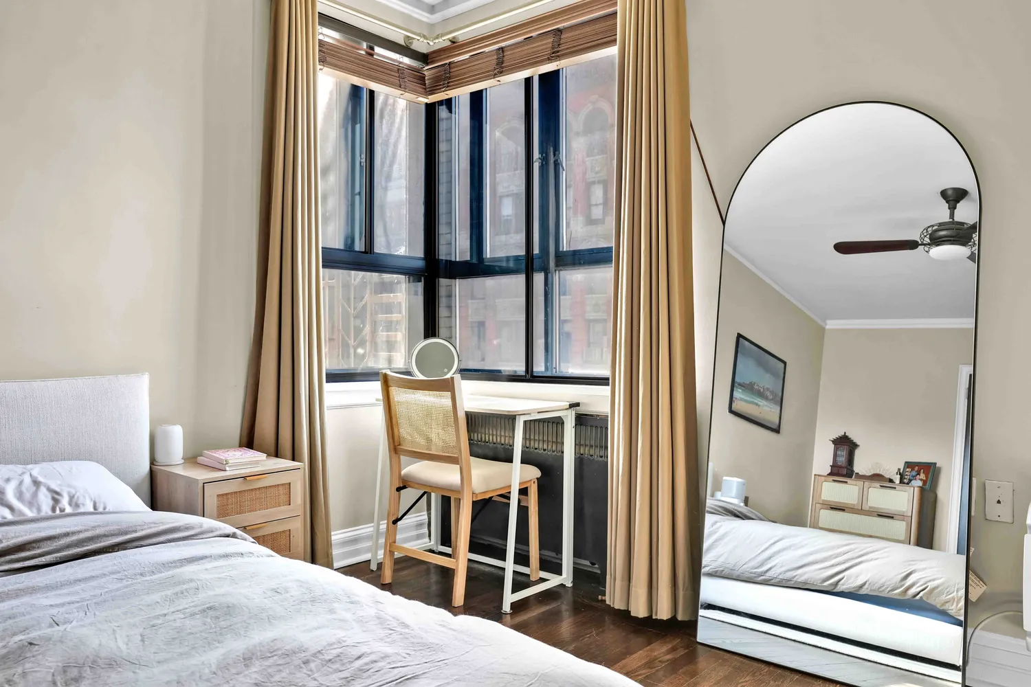 a bedroom with a large bed and a large window