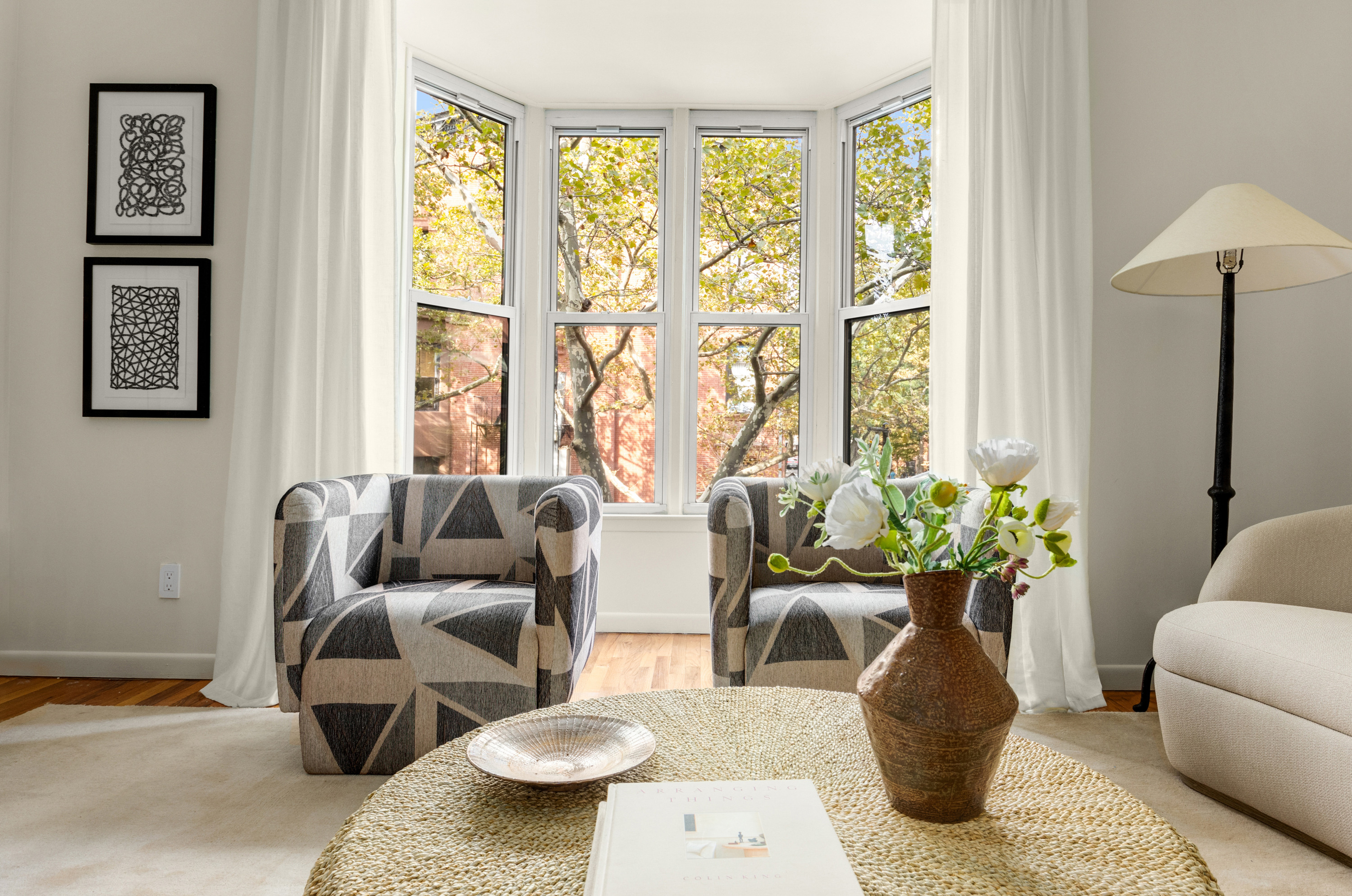 238 Clinton Street, Unit DE Brooklyn, NY 11201 - Photo 3 of 19 a living room with furniture and a potted plant