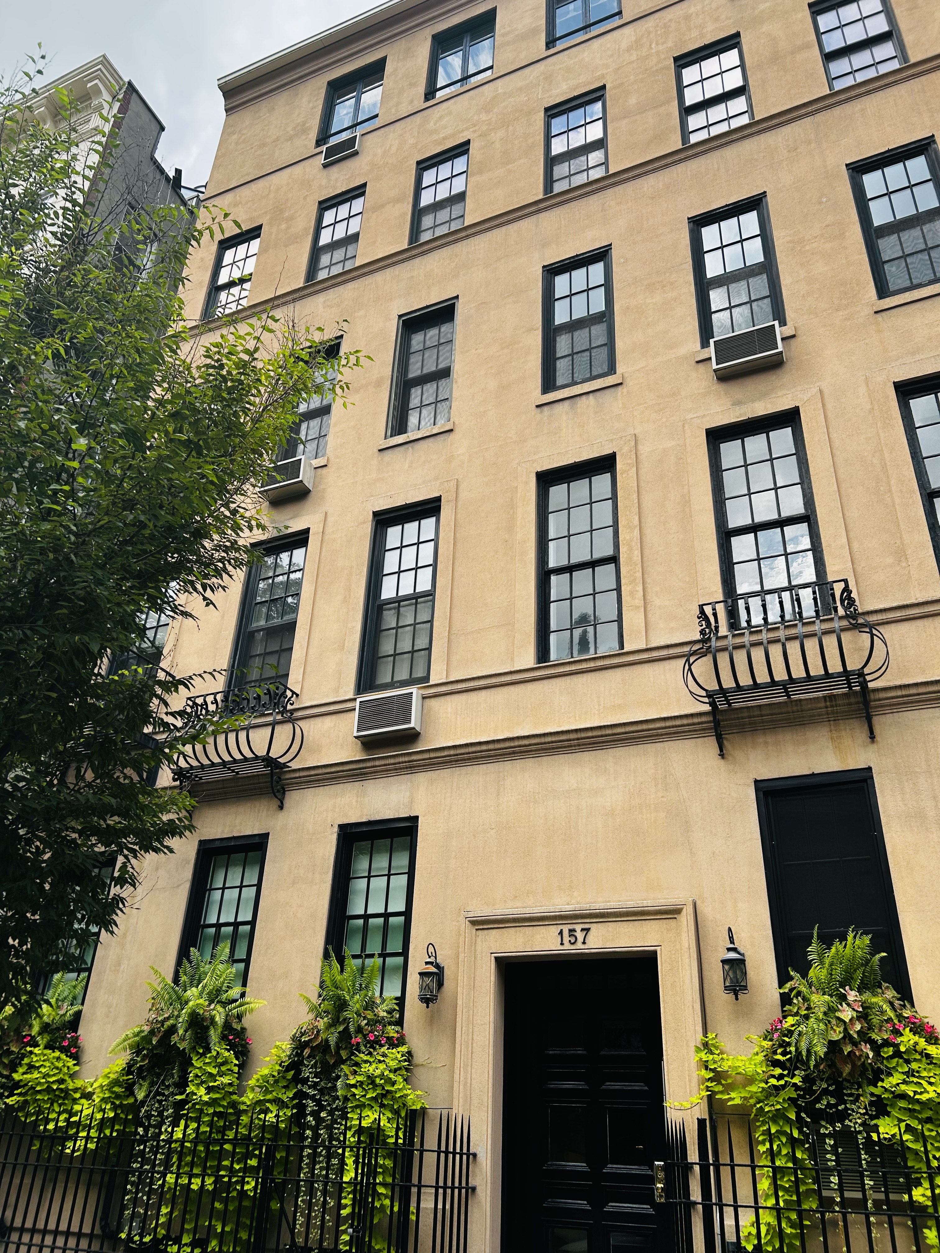 157 East 75th Street, Unit 1E Manhattan, NY 10021 - Photo 10 of 11 a front view of a multi story residential apartment building
