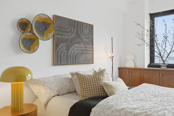 a living room with furniture and a painting