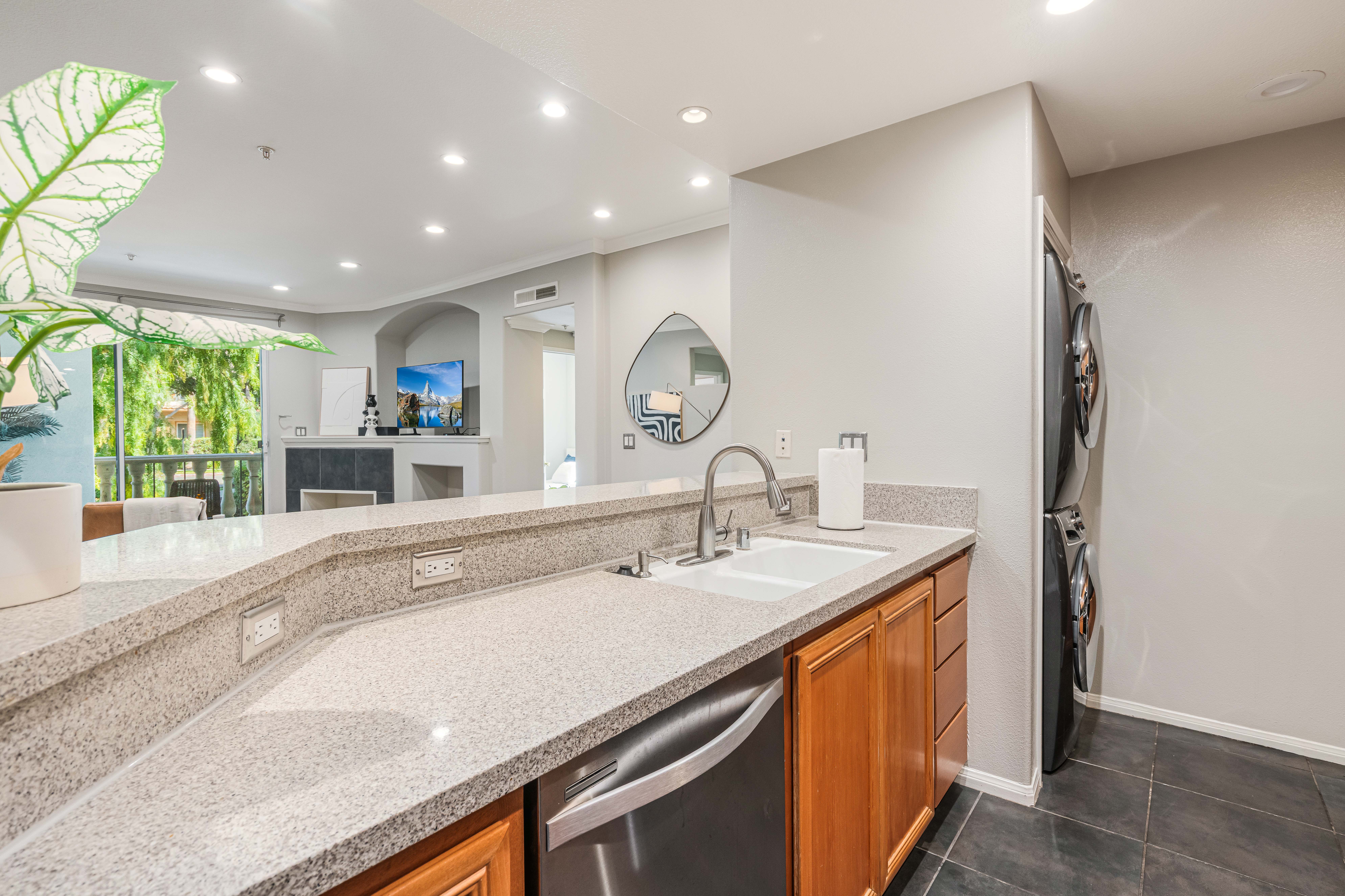 12963 West Runway Road Playa Vista, CA 90094 - Photo 8 of 39 a kitchen with a sink and a refrigerator