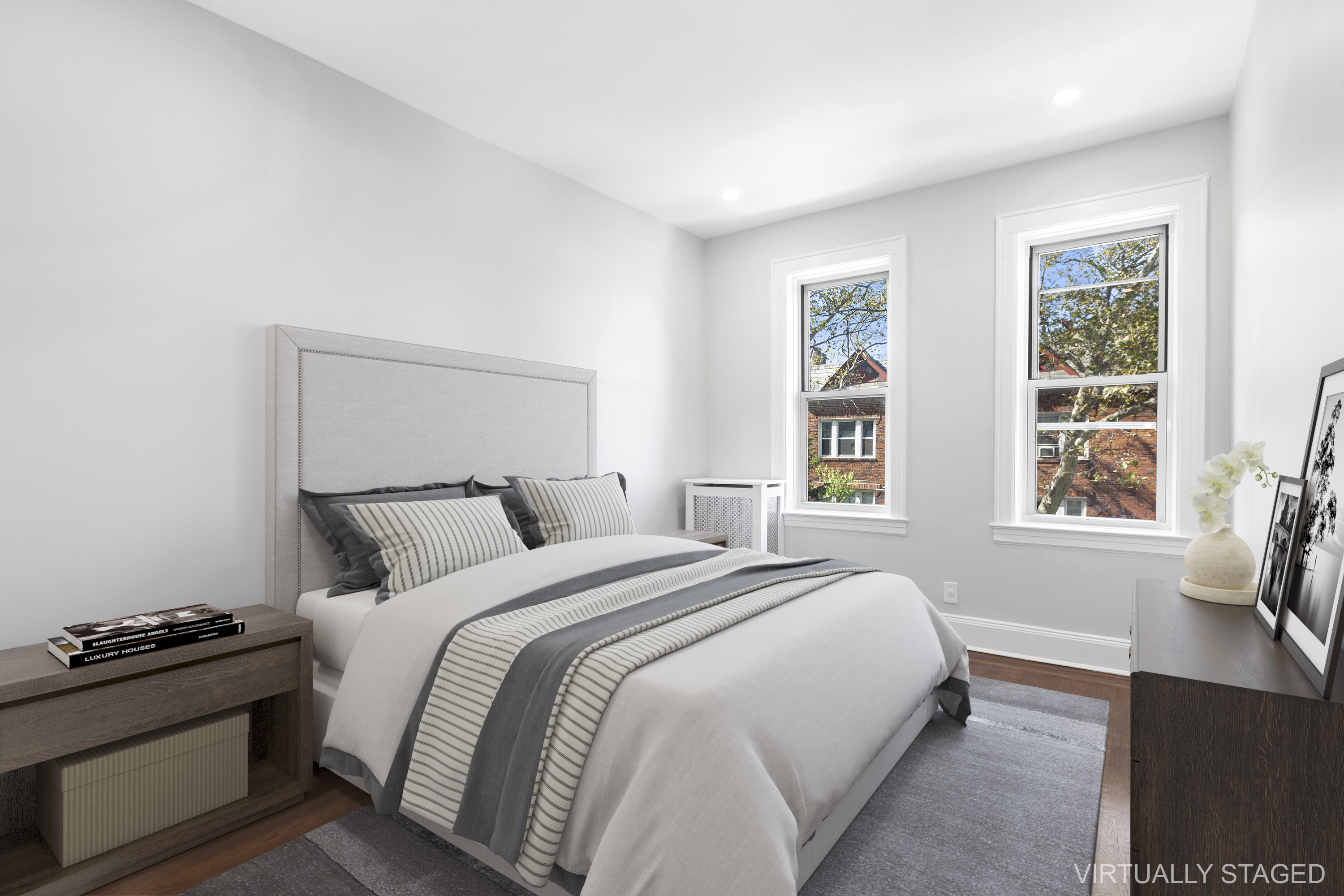 45-15 41st Street, Unit 3R Queens, NY 11104 - Photo 4 of 7 a bedroom with a bed and a window