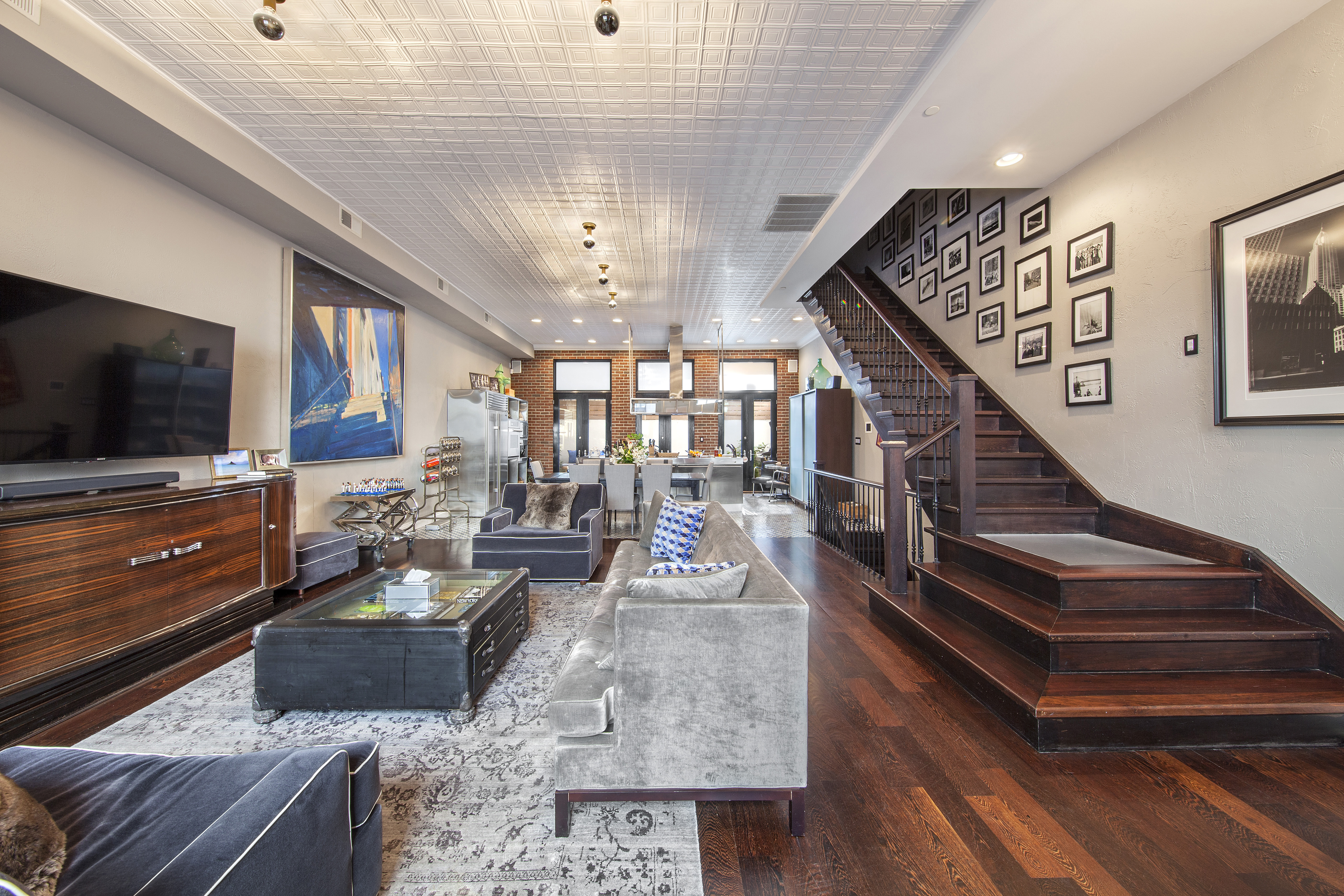 4 Centre Market Place Manhattan, NY 10013 - Photo 1 of 15 a living room with furniture and a flat screen tv