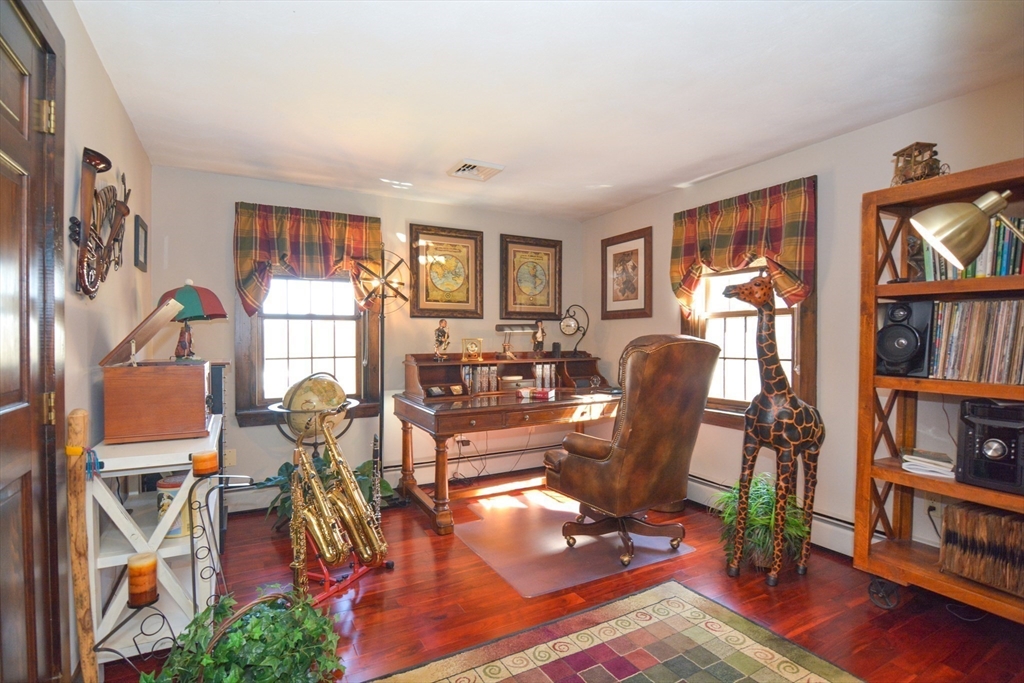 187 Blackstone Street Mendon, MA 01756 - Photo 24 of 42 a view of a livingroom with furniture and a book shelf