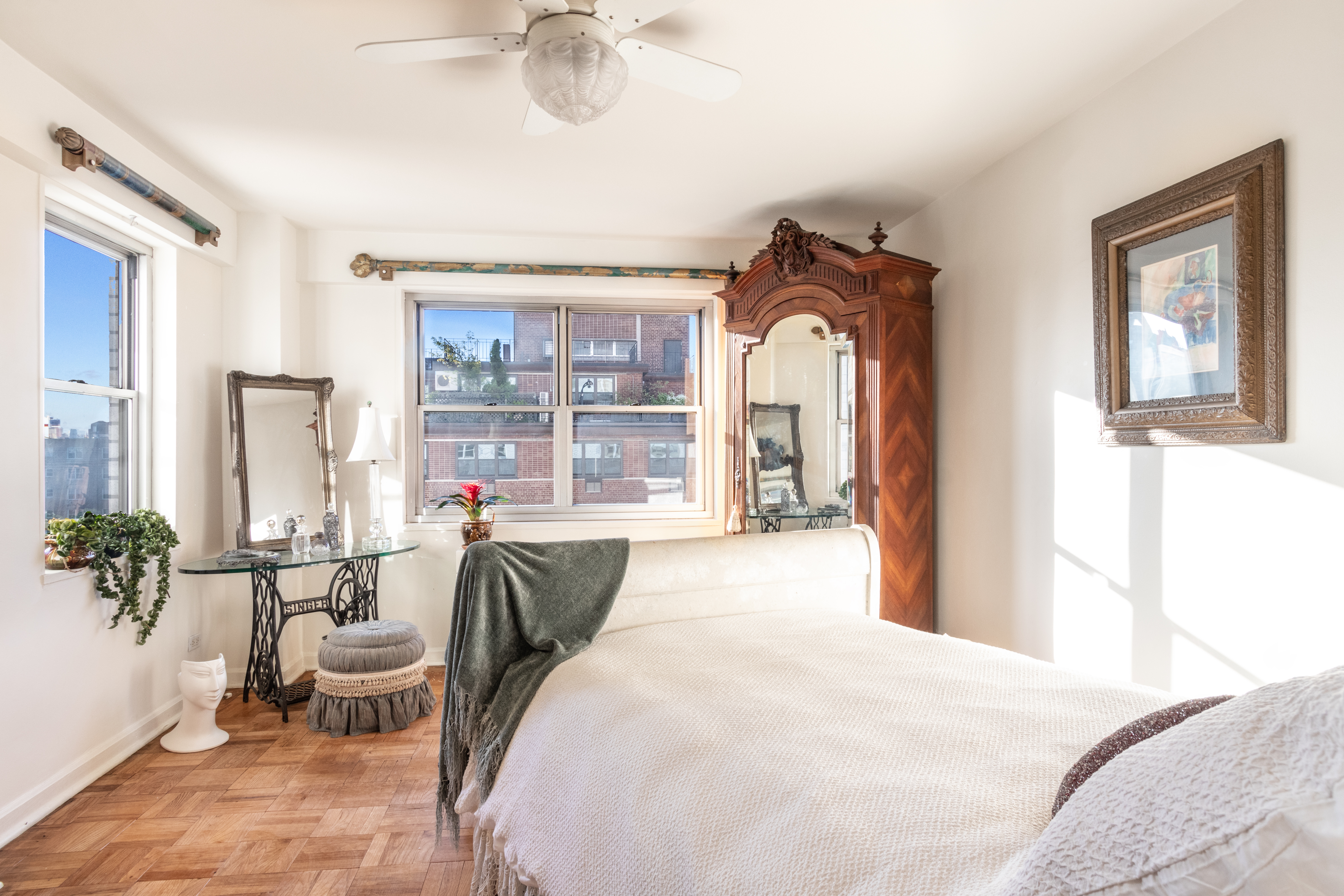 70 East 10th Street, Unit 14M Manhattan, NY 10003 - Photo 8 of 22 a bedroom with a bed and a large mirror