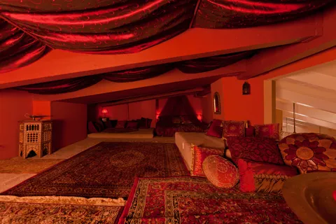 a bed room with a bed and a potted plant