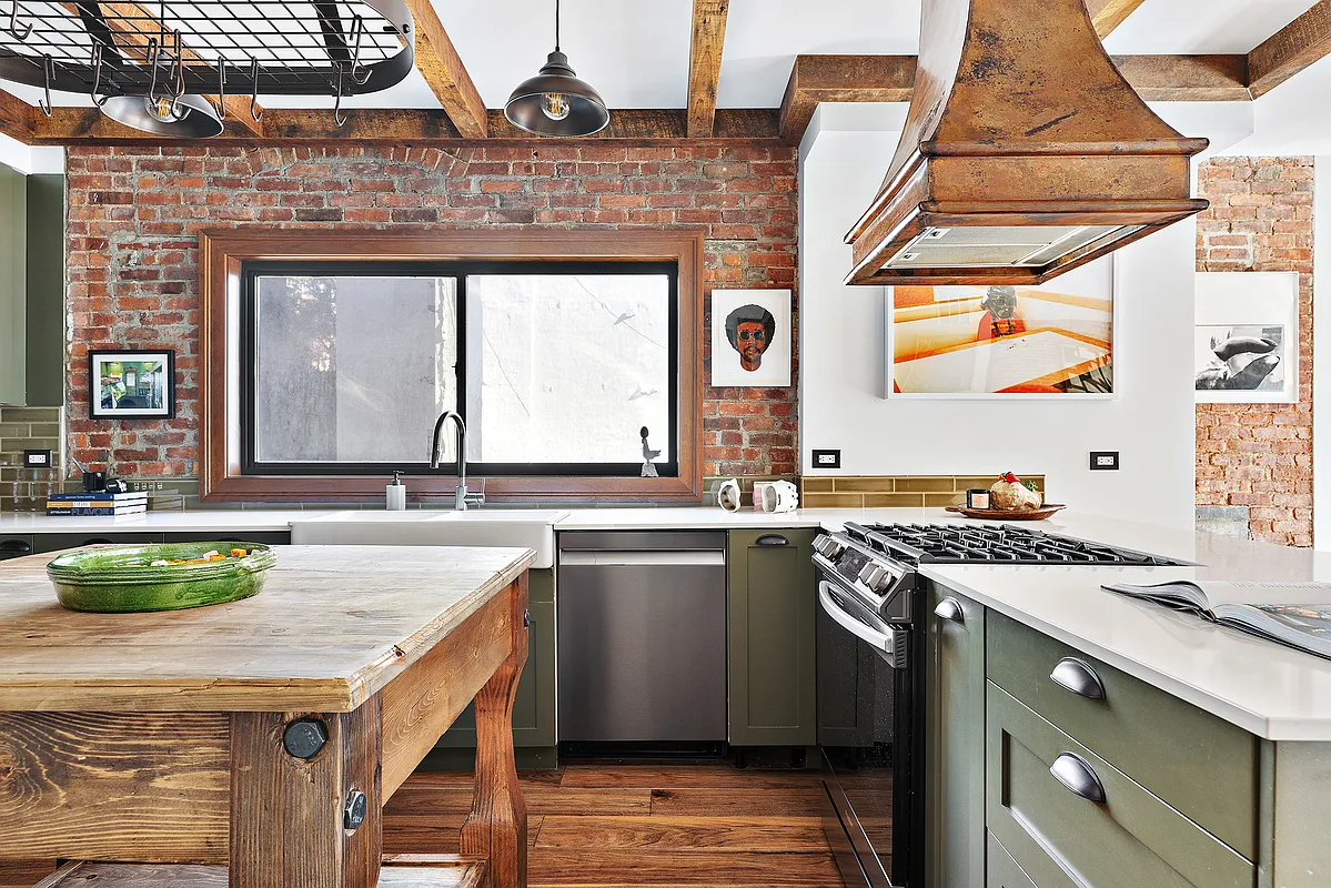 115 Allen Street, Unit 3 Manhattan, NY 10002 - Photo 1 of 13 a kitchen with a stove a sink and a refrigerator