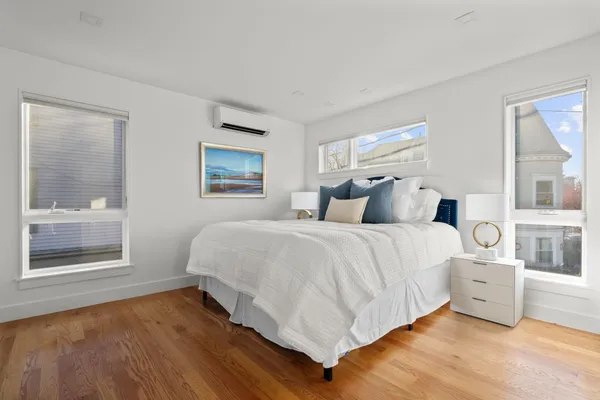 a bedroom with a bed and window