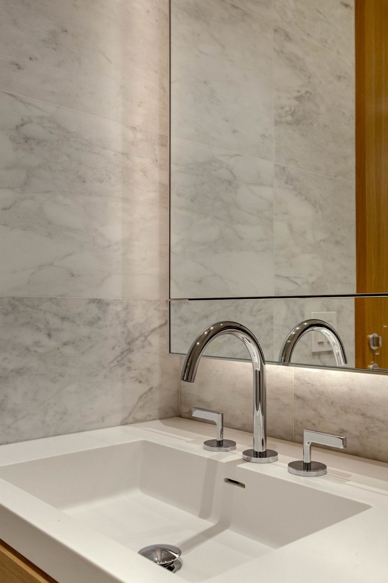 565 Broome Street, Unit N6I Manhattan, NY 10013 - Photo 6 of 15 a bathroom with a sink and mirror