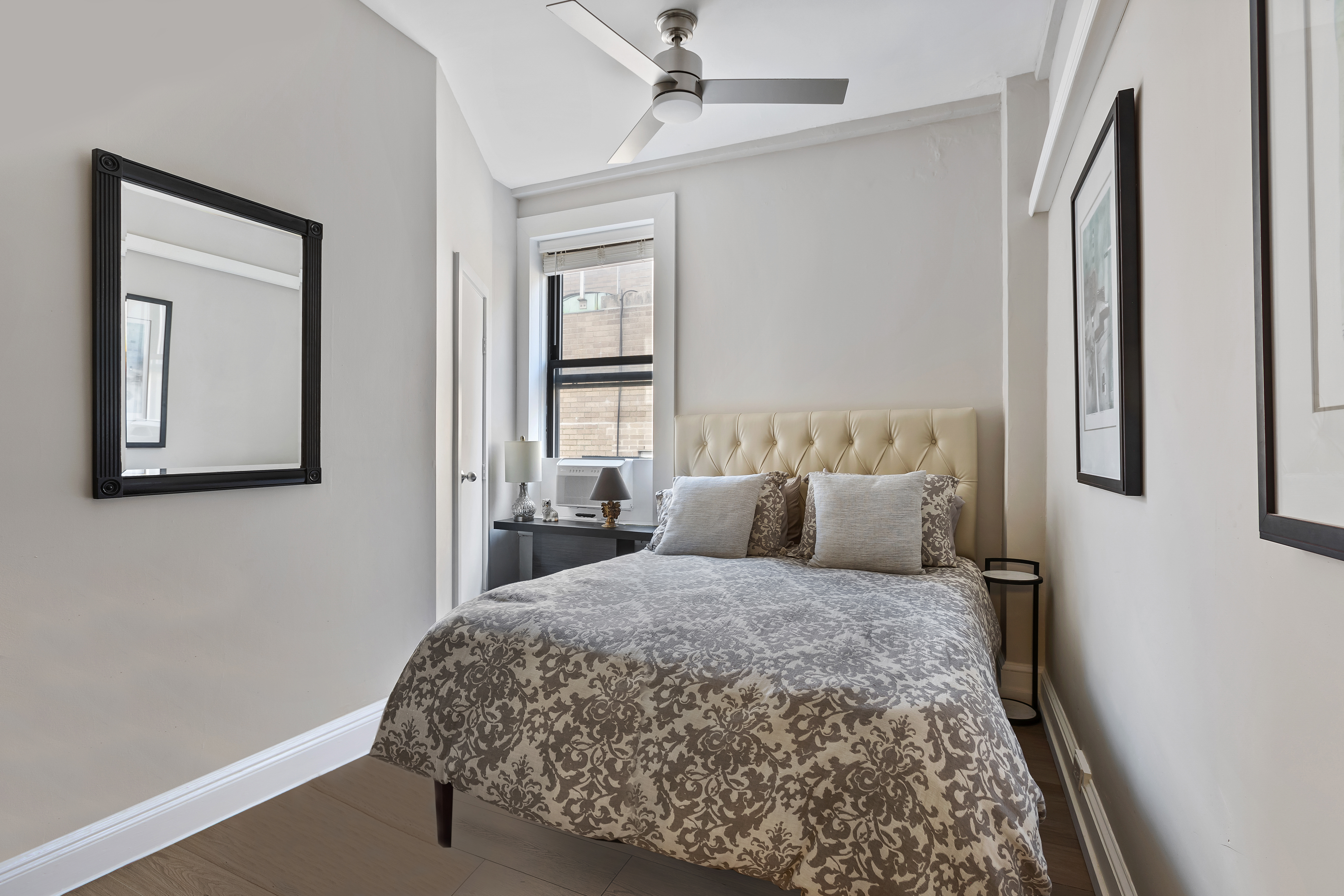 420 Riverside Drive, Unit 7K Manhattan, NY 10025 - Photo 4 of 7 a bedroom with a large bed and a window