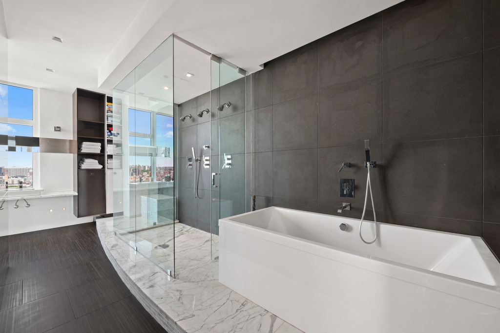 111 Central Park North, Unit PHB Manhattan, NY 10026 - Photo 13 of 17 a bathroom with a bathtub and a shower