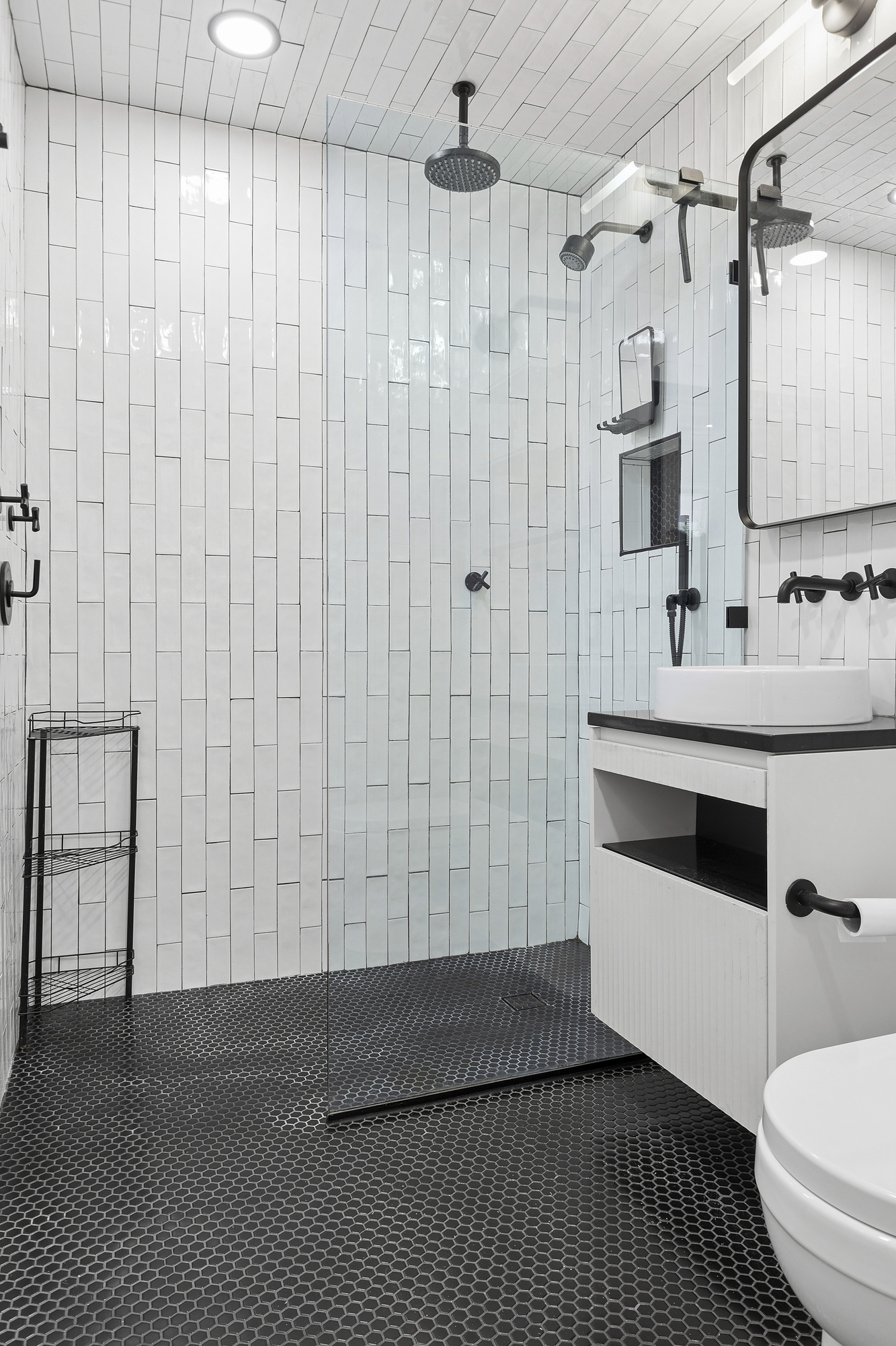 248 East 7th Street, Unit 3/4 Manhattan, NY 10009 - Photo 8 of 11 a bathroom with a sink a toilet and shower