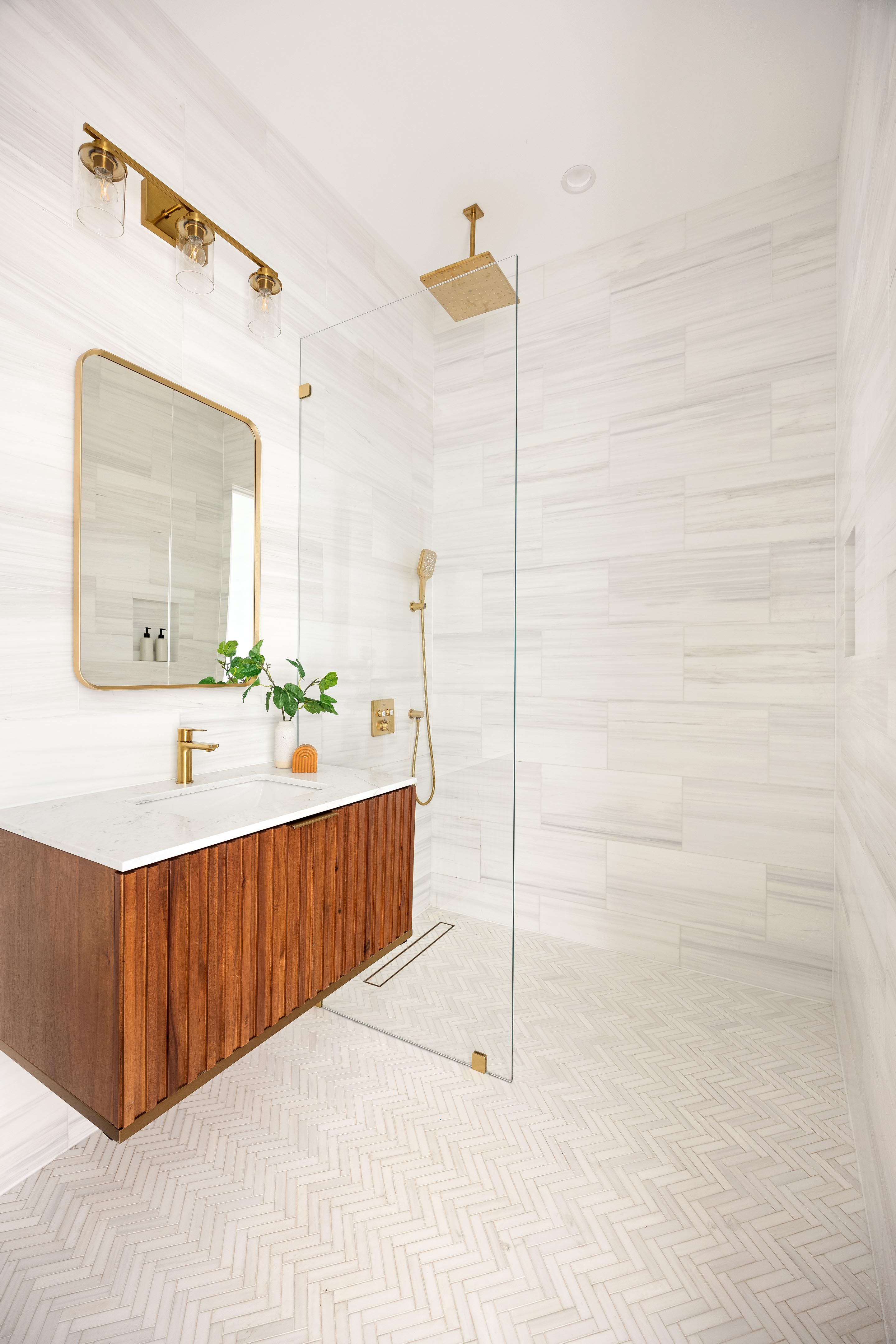 282 17th Street, Unit 2 Brooklyn, NY 11215 - Photo 6 of 11 a bathroom with a sink a mirror and a shower