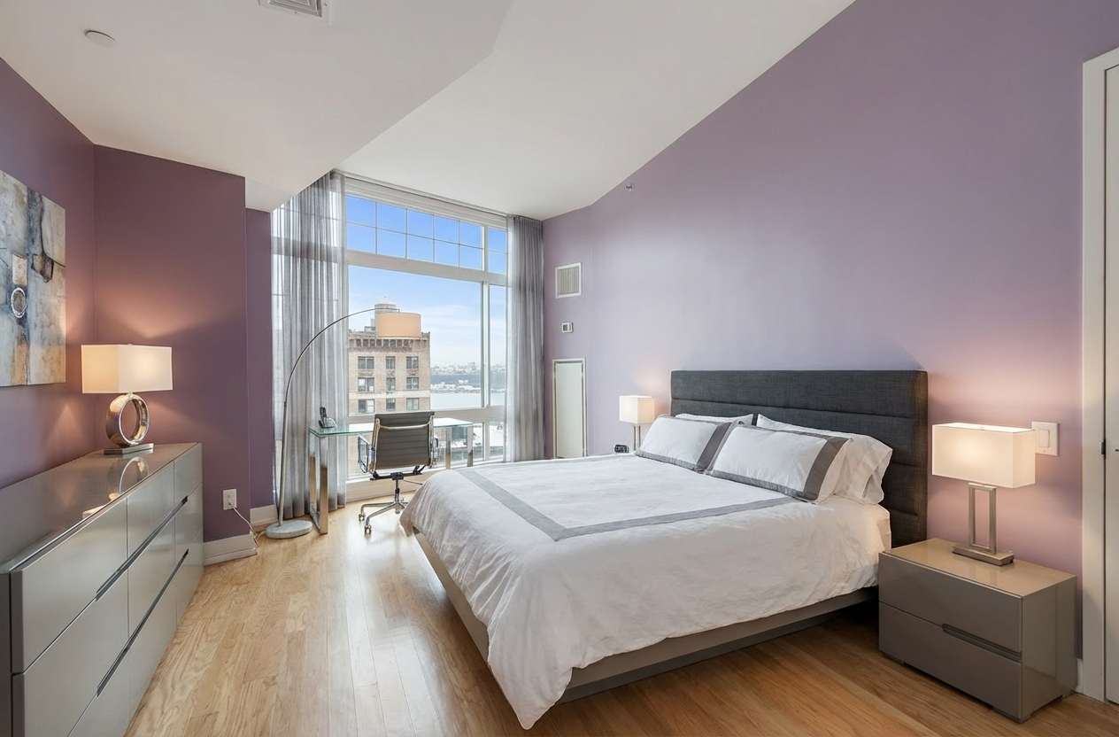 272 West 107th Street, Unit 15B Manhattan, NY 10025 - Photo 6 of 10 a bedroom with a bed and lamp