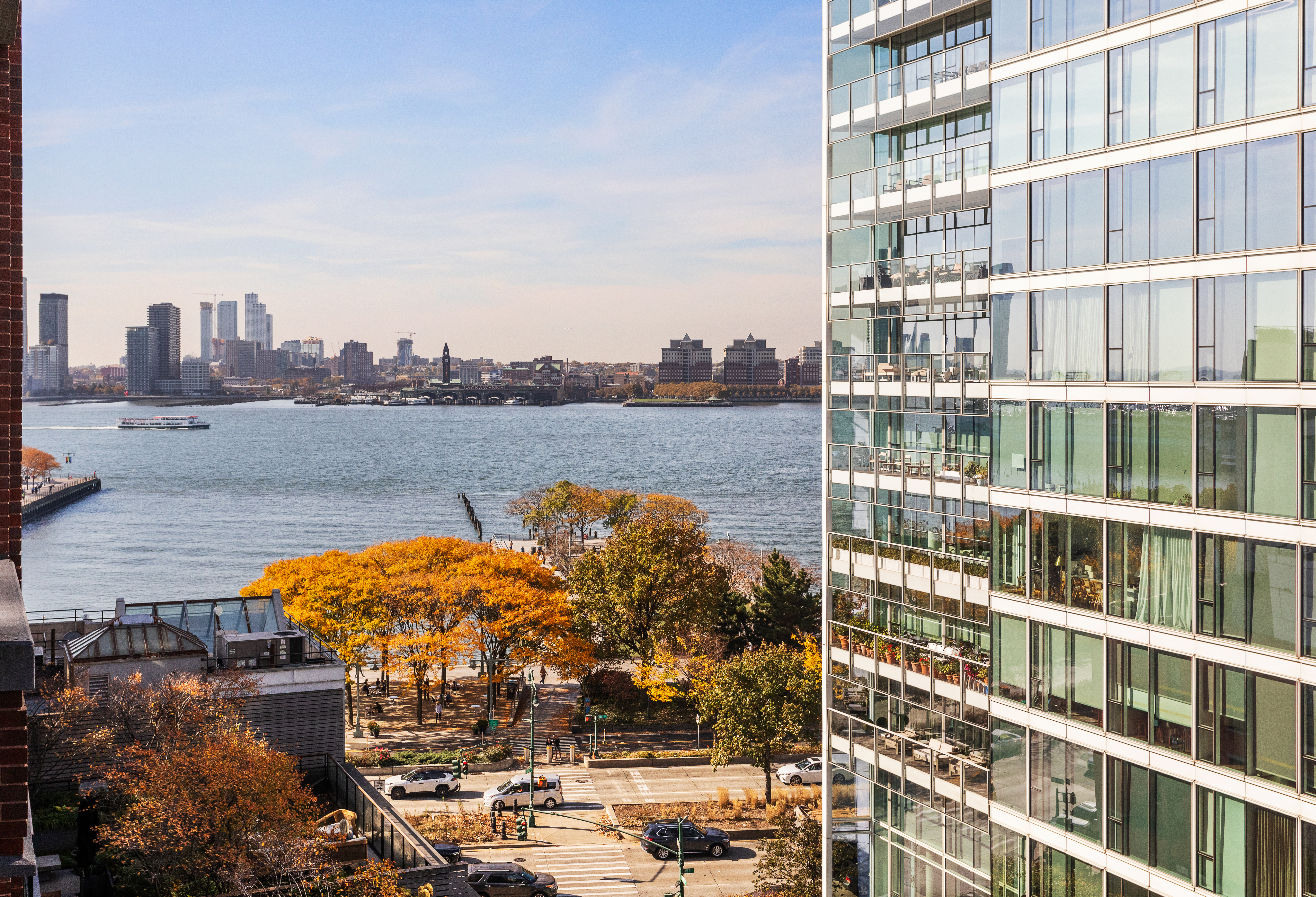 150 Charles Street, Unit 7CN Manhattan, NY 10014 - Photo 2 of 13 a view of a lake with building in front of it