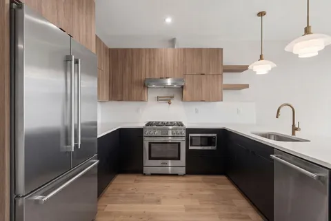 a kitchen with a sink and a stove