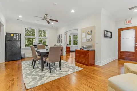 a view of a dining room with furniture window and wooden floor