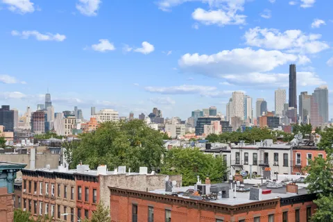a view of a city with tall buildings