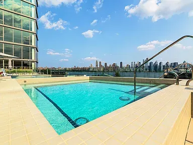 a view of a swimming pool and an outdoor space