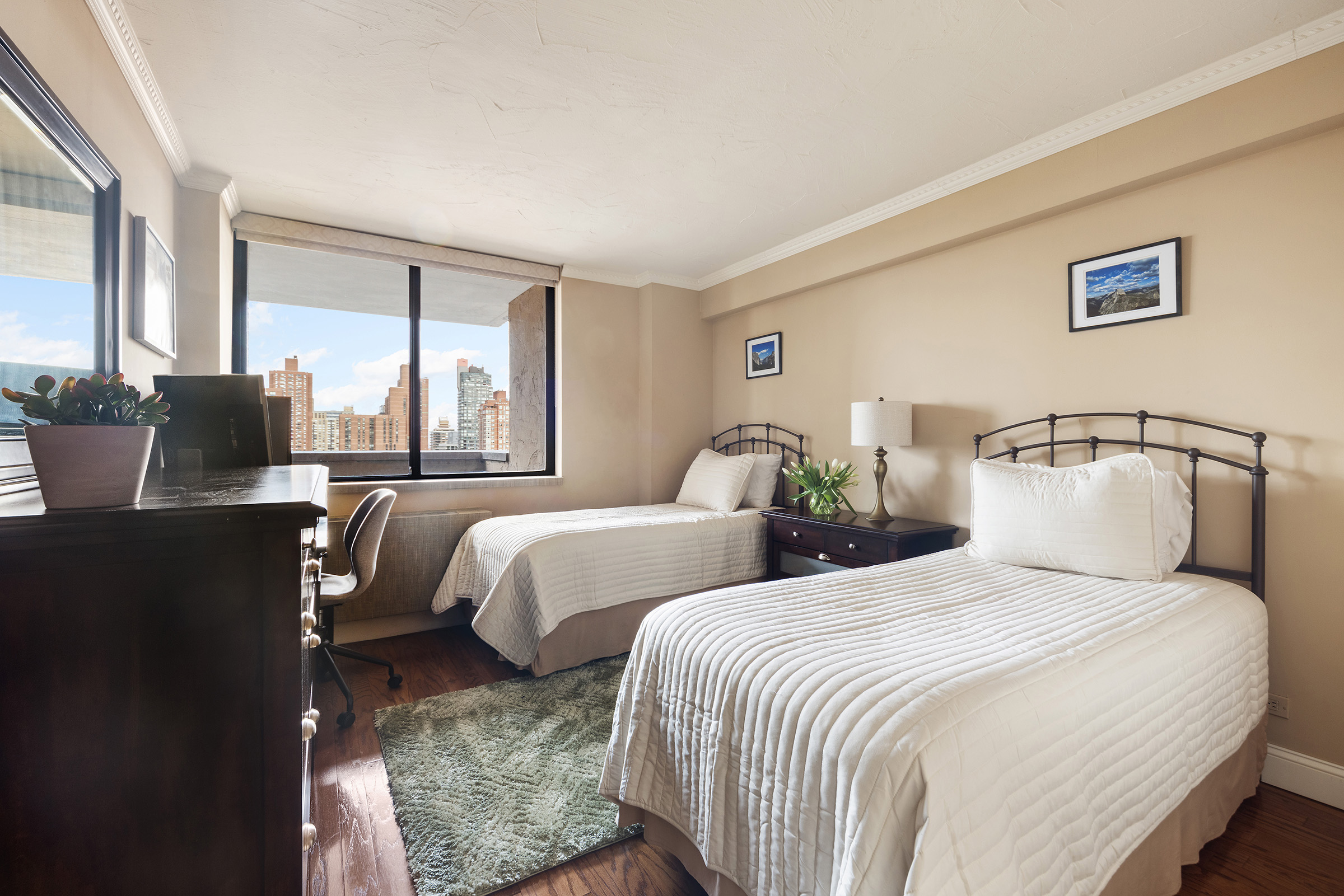 233 East 86th Street, Unit PHB Manhattan, NY 10028 - Photo 7 of 12 a bedroom with two beds and large windows