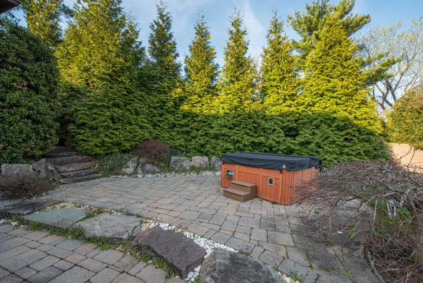 a backyard of a house with large trees
