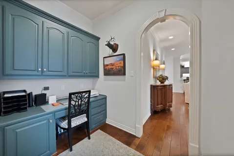 a view of a livingroom with furniture and cabinet