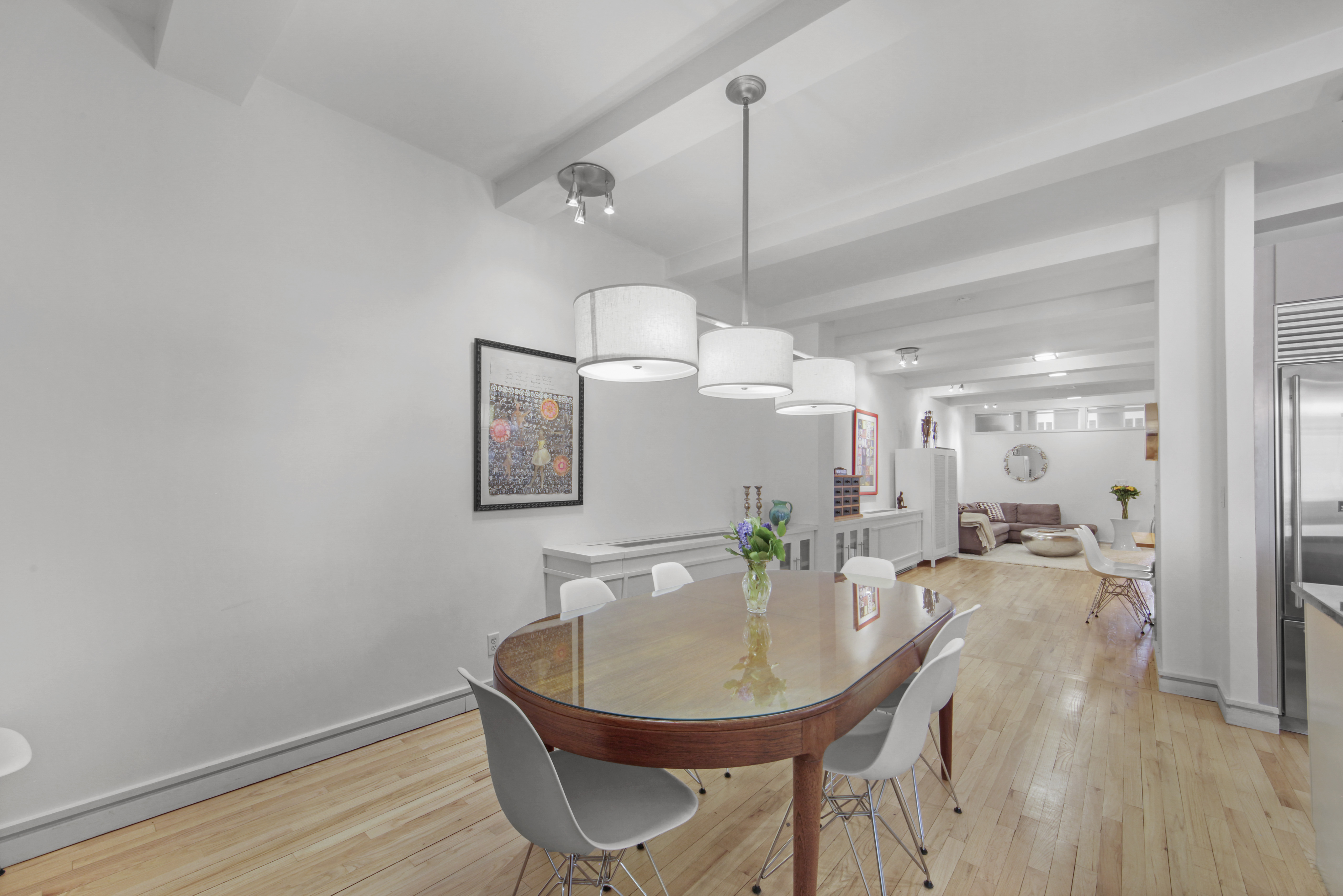 18 East 12th Street, Unit 7BC Manhattan, NY 10003 - Photo 12 of 26 a view of a dining room with furniture and wooden floor