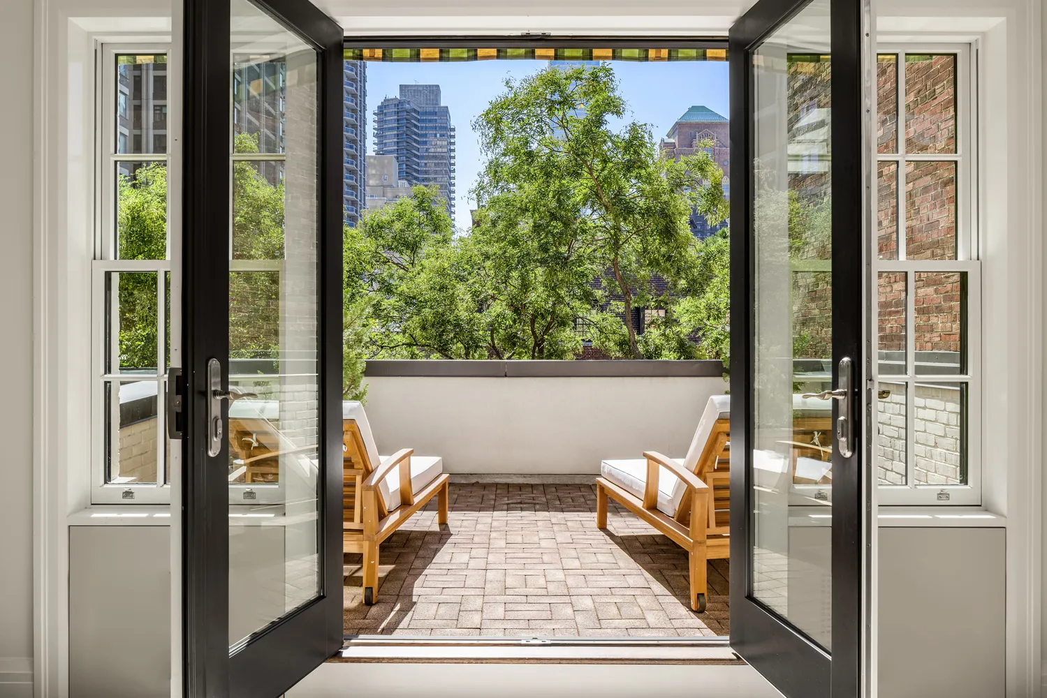 a view of balcony with furniture