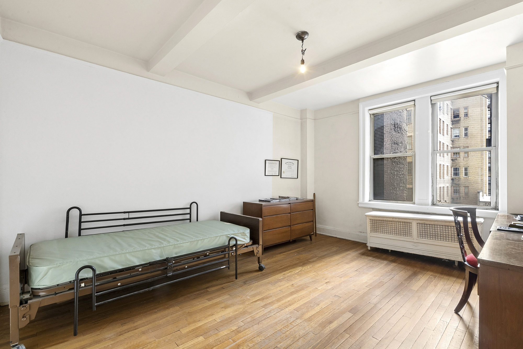 12 West 96th Street, Unit 9A Manhattan, NY 10025 - Photo 12 of 14 a living room with furniture and wooden floor