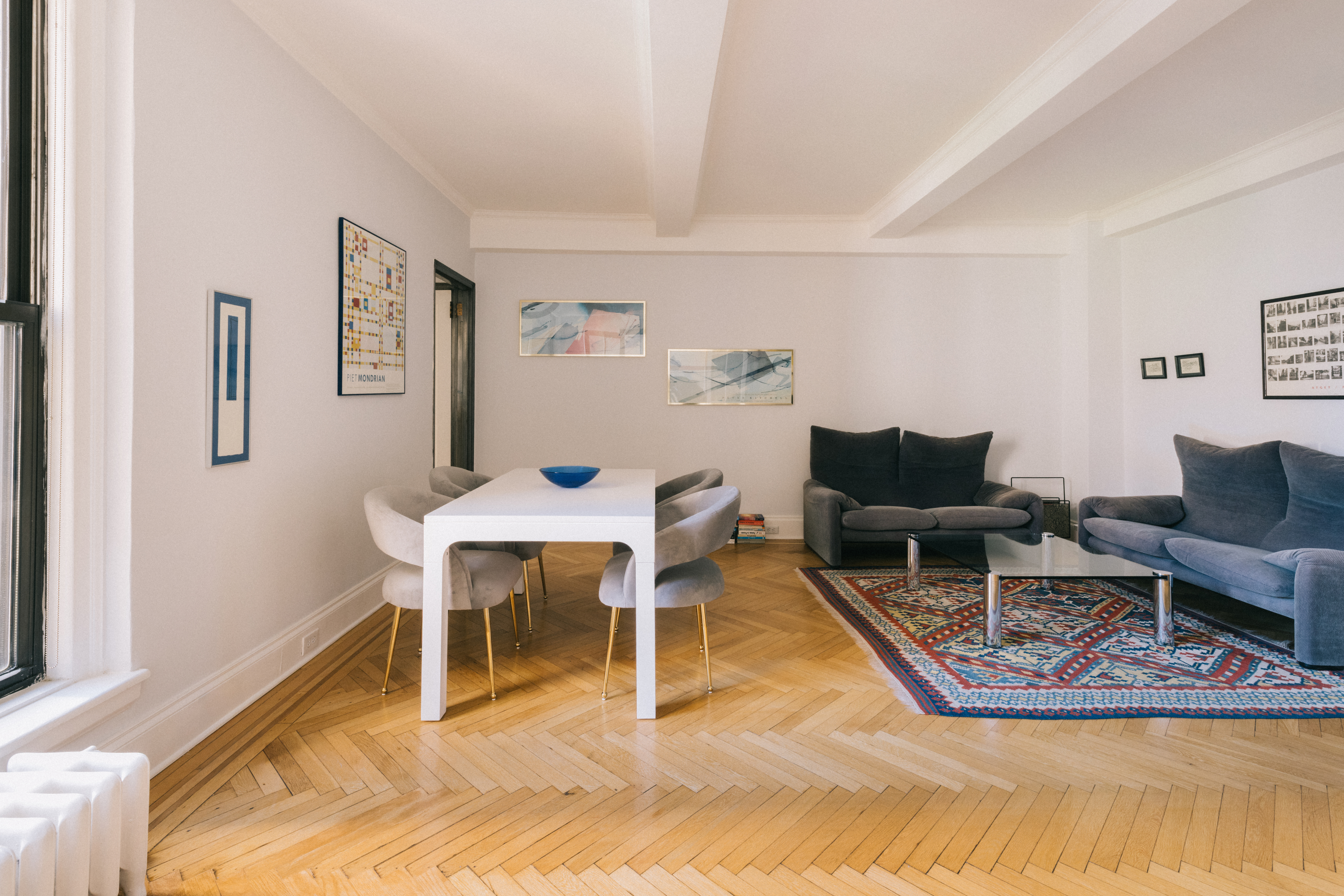 124 West 93rd Street, Unit 6E Manhattan, NY 10025 - Photo 3 of 9 a living room with furniture a rug and a table