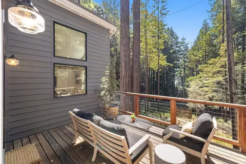 a view of a two chairs in the balcony