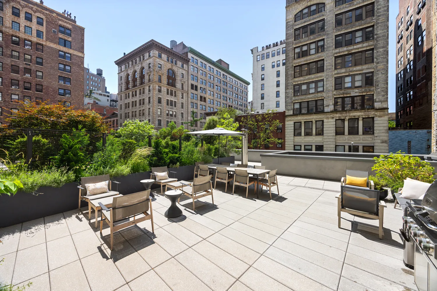 a view of a patio with a table and chairs and potted plants