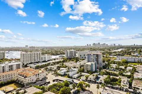 a living room filled with furniture and a chandelier