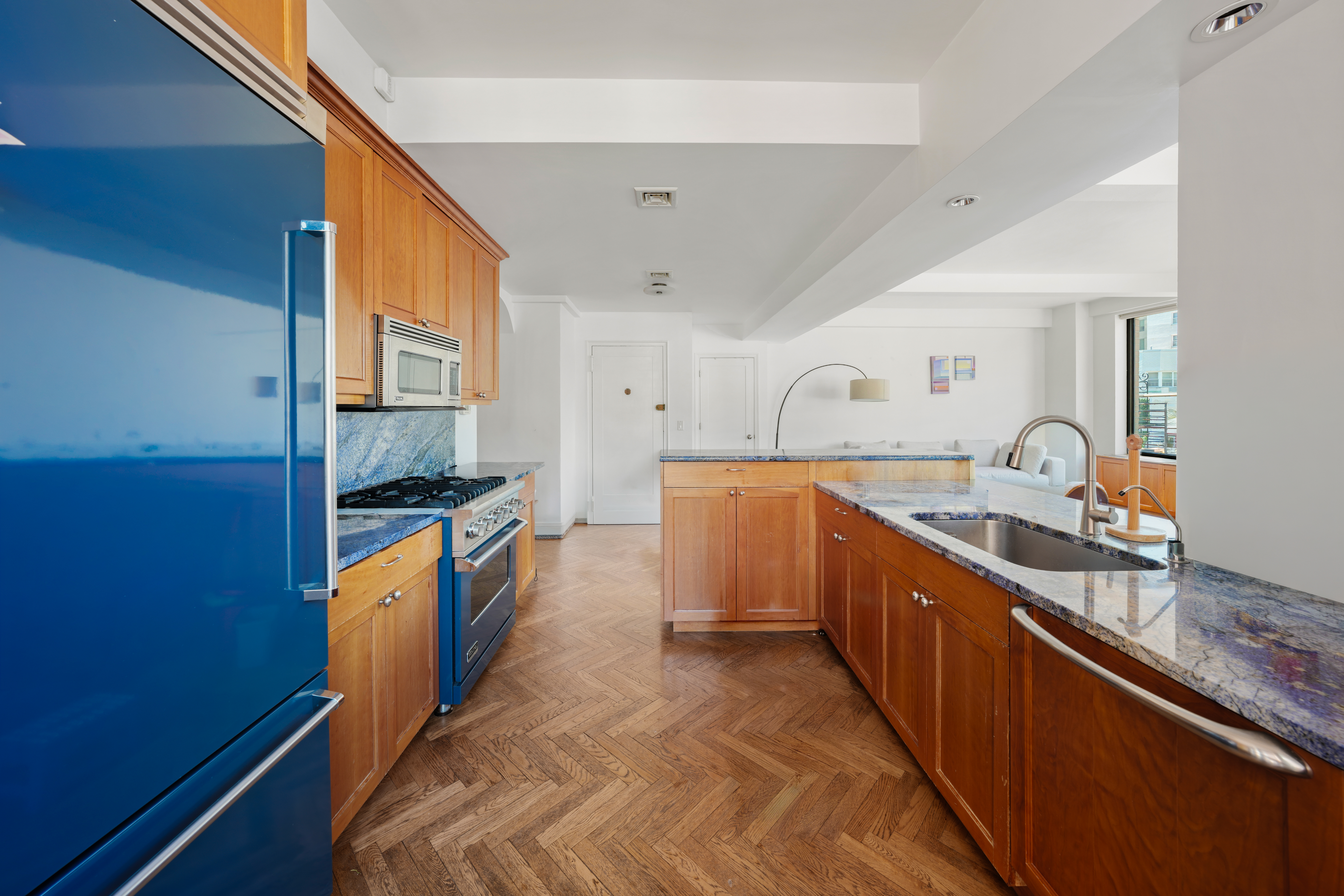 177 East 77th Street, Unit PHC Manhattan, NY 10075 - Photo 9 of 26 a kitchen with stainless steel appliances granite countertop a sink and a stove