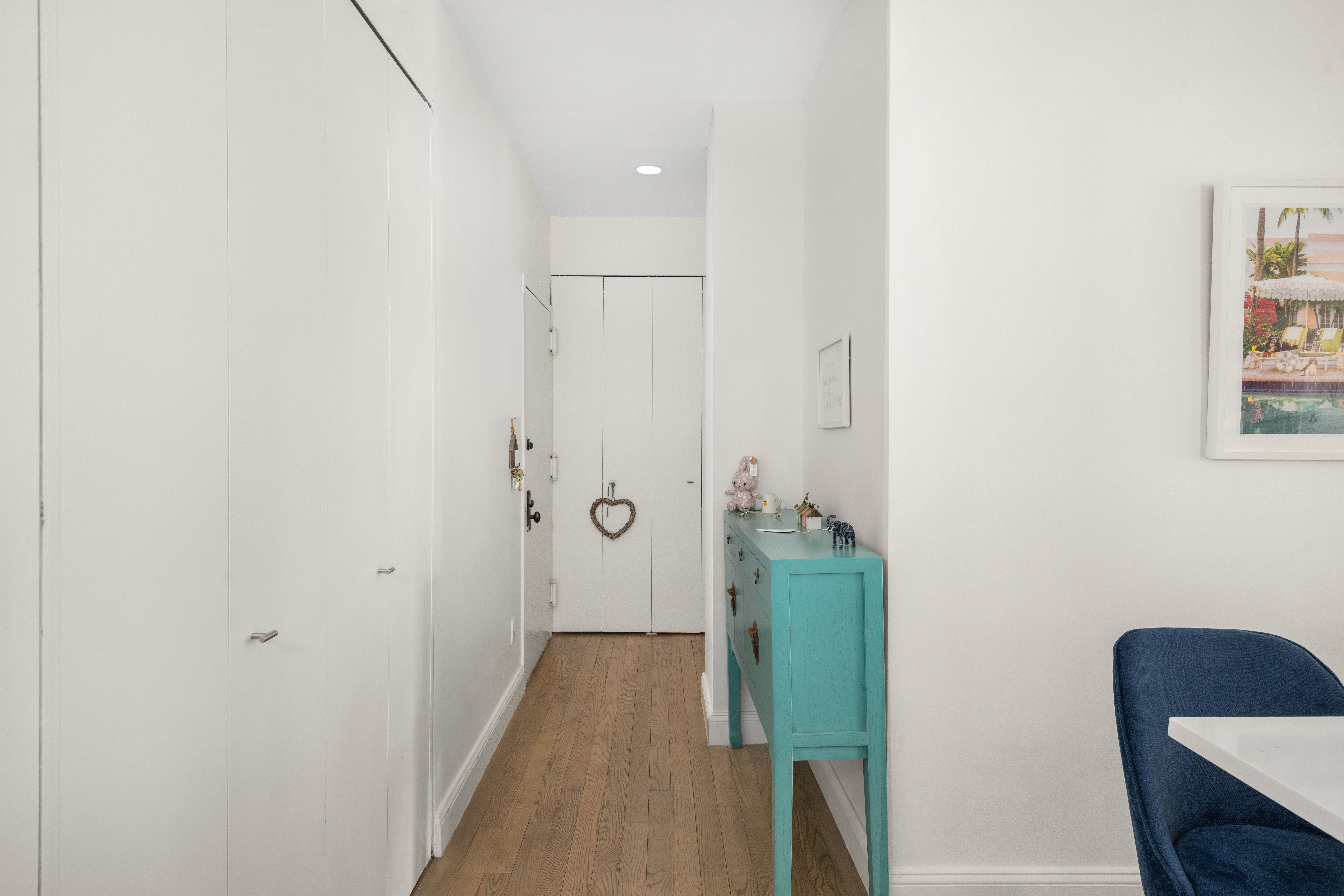 253 West 73rd Street, Unit 4N Manhattan, NY 10023 - Photo 8 of 9 a view of a hallway with closet and wooden floor