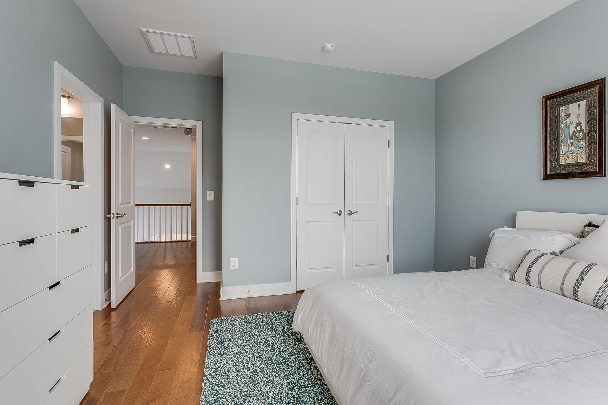1011 Justinian Street Leesburg, VA 20175 - Photo 39 of 56 a bedroom with a bed and wooden floor