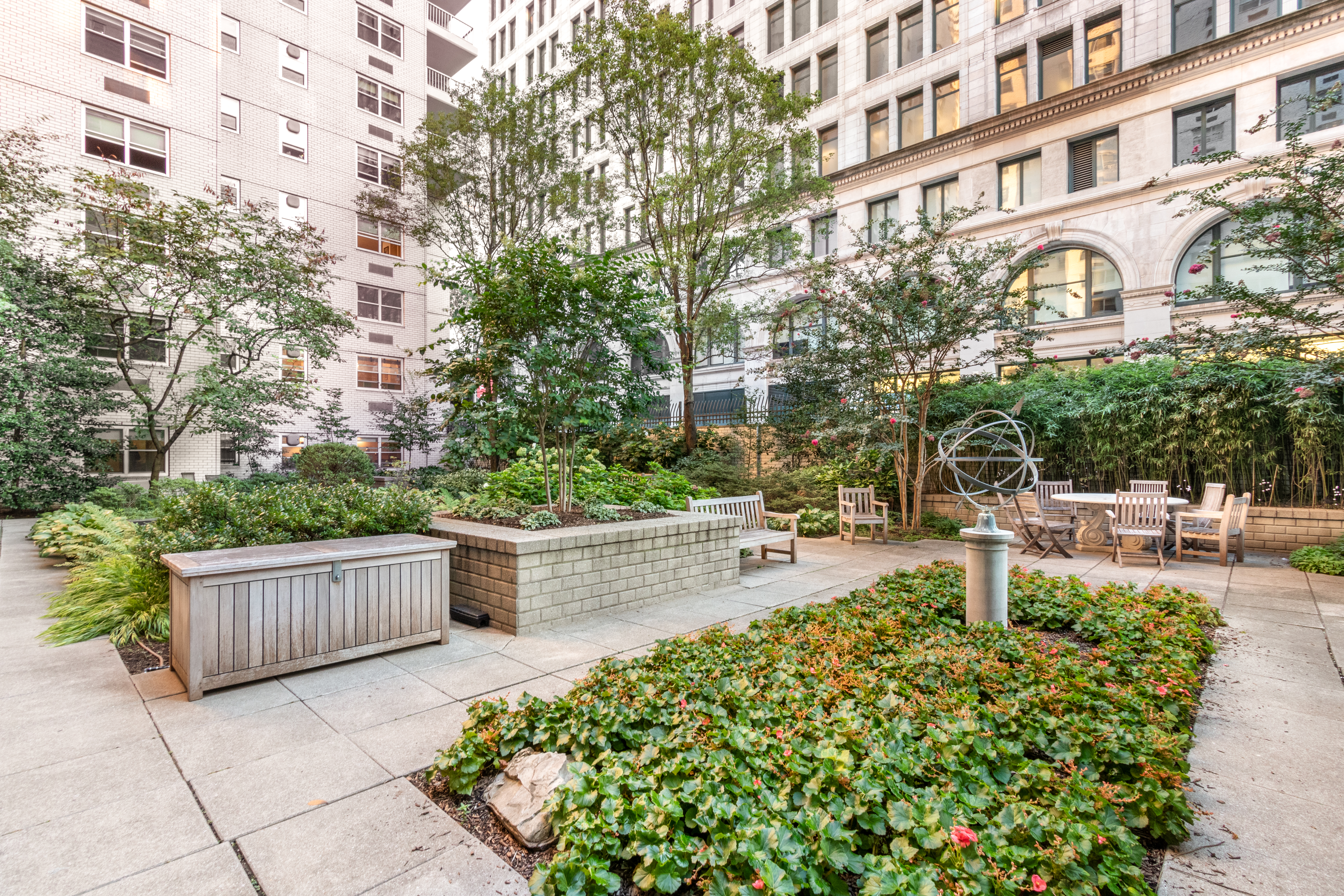 70 East 10th Street, Unit 14M Manhattan, NY 10003 - Photo 15 of 22 a view of a patio with couches and table and chairs and potted plants