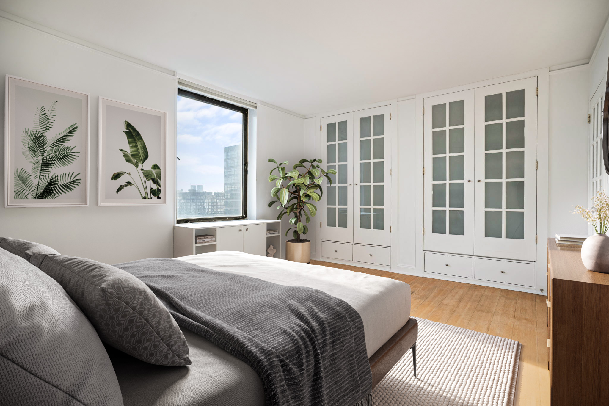 1623 3rd Avenue, Unit 31G Manhattan, NY 10128 - Photo 7 of 9 a bedroom with a large bed and a large window