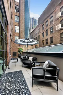 a view of a building and outdoor seating