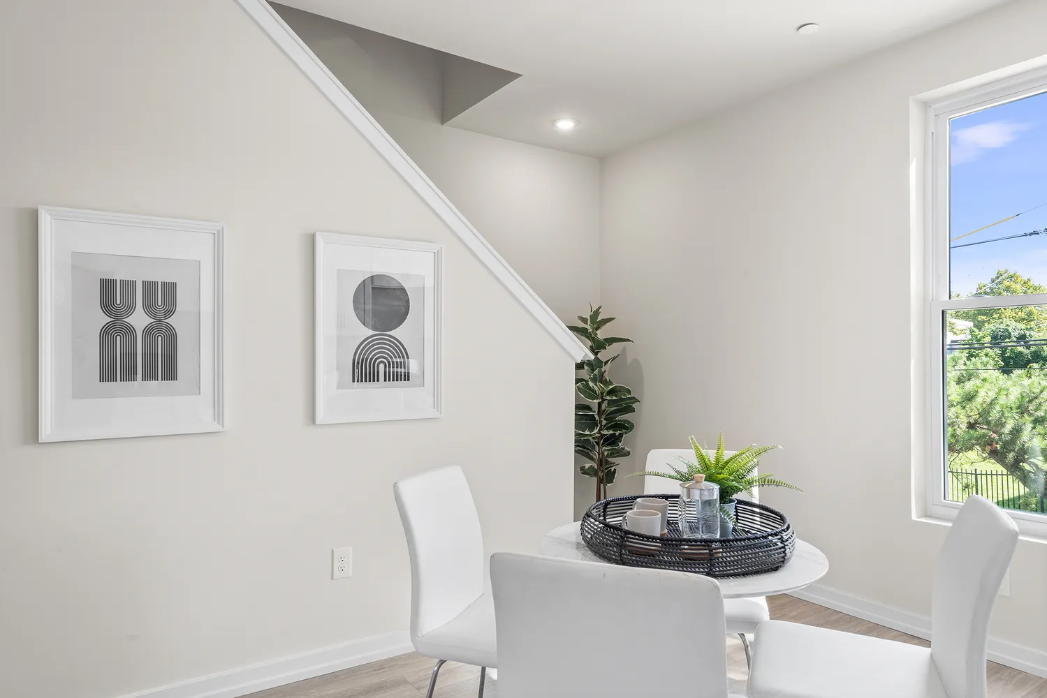 a bedroom with a bed and painting on the wall