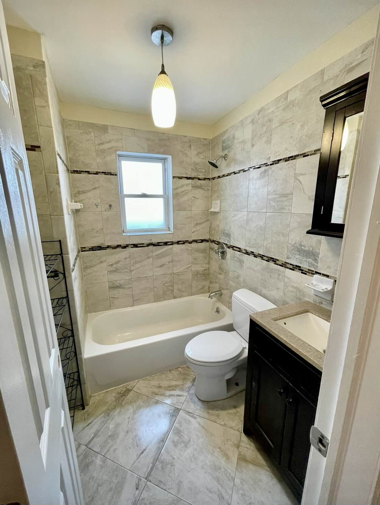 3194 Webster Avenue Bronx, NY 10467 - Photo 15 of 23 a bathroom with a sink a toilet a mirror and bathtub