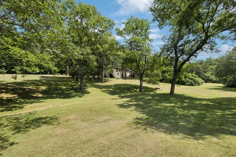 a view of a lake with a house