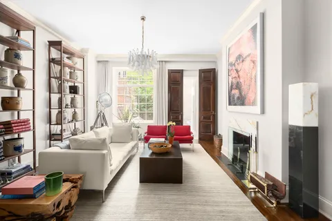 a living room with furniture fireplace and flat screen tv