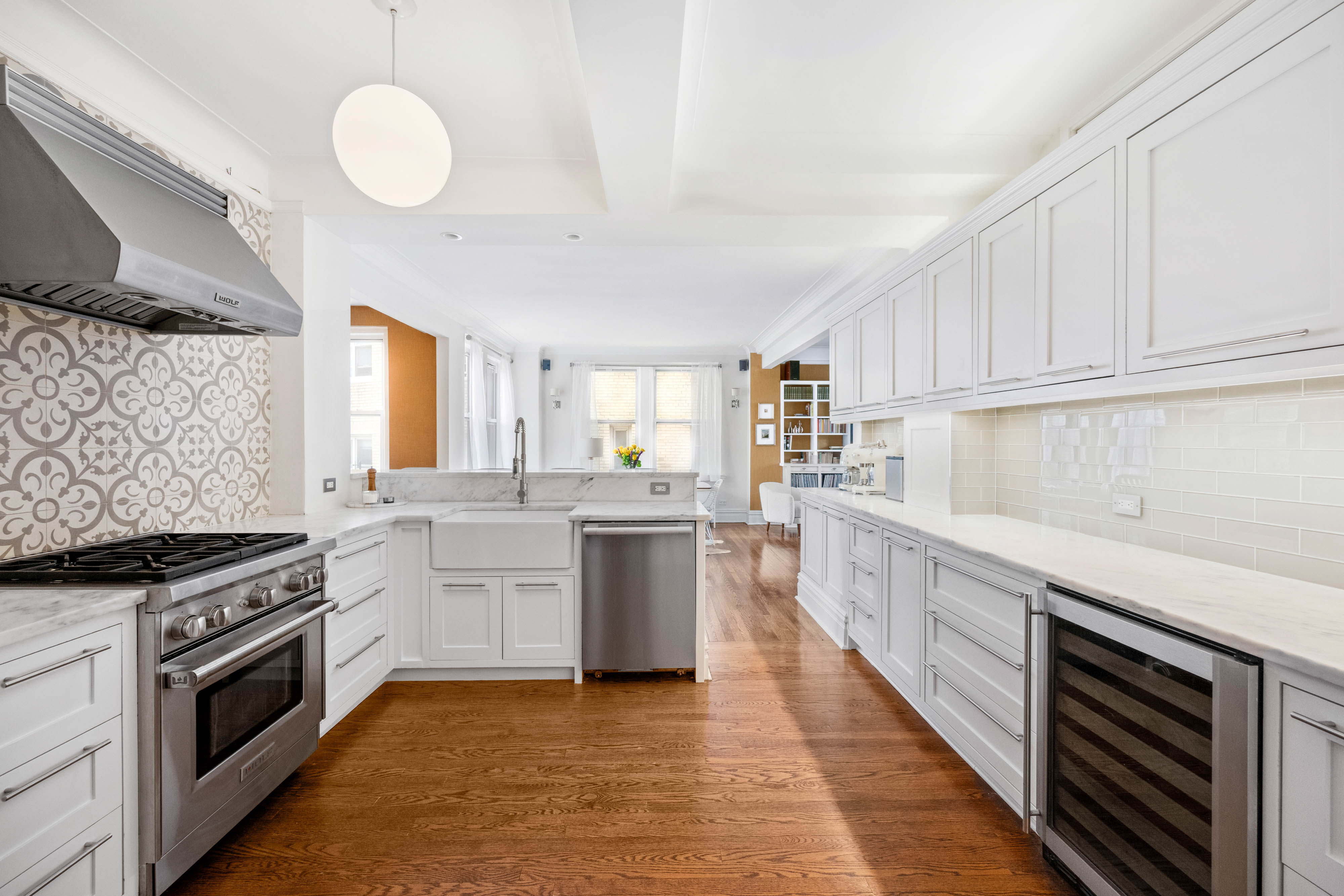 136 East 36th Street, Unit 9/10C Manhattan, NY 10016 - Photo 4 of 27 a kitchen with a sink stove top oven and cabinets