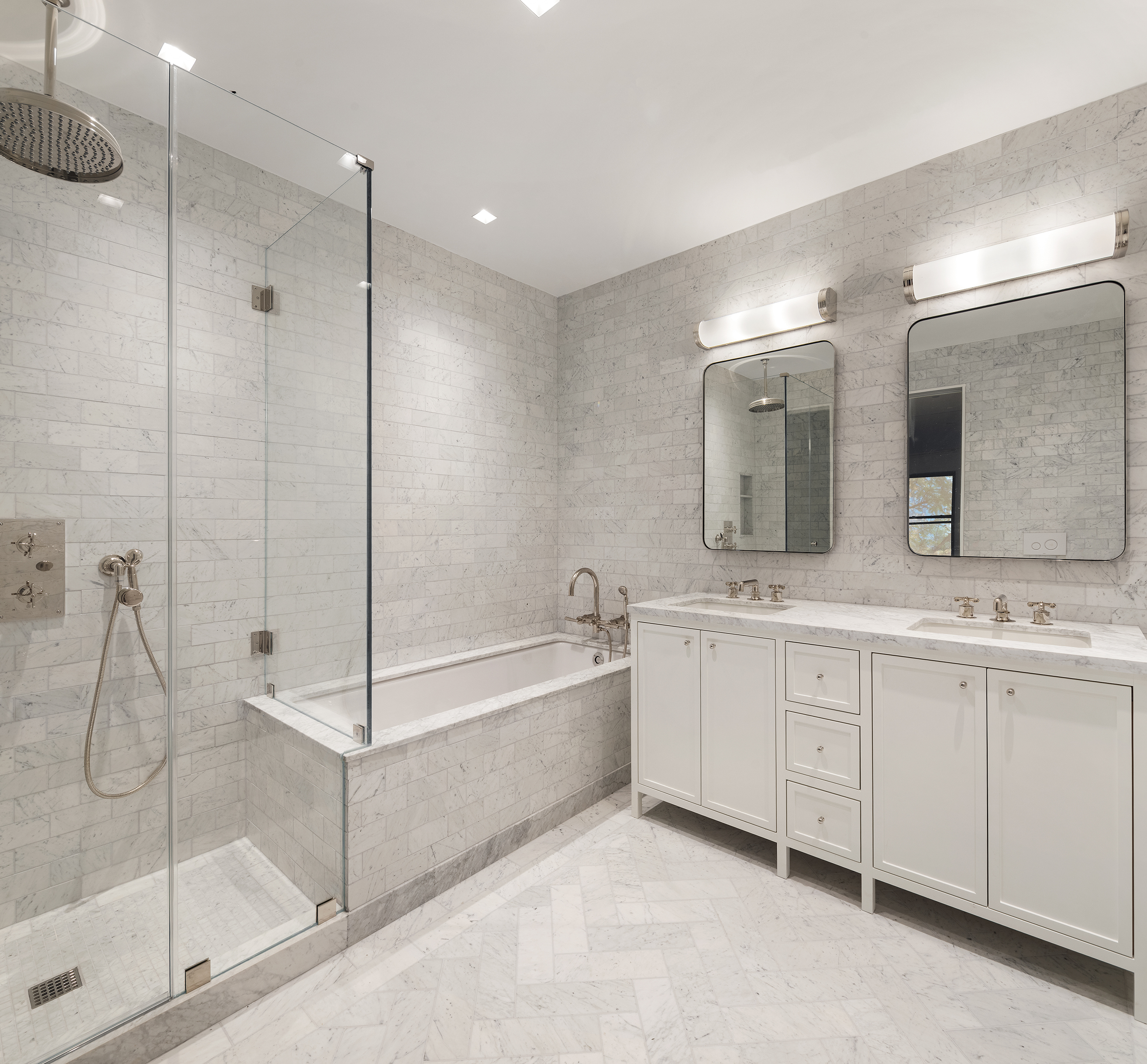 243 West Broadway, Unit 4 Manhattan, NY 10013 - Photo 8 of 14 a bathroom with a tub sink shower and mirror