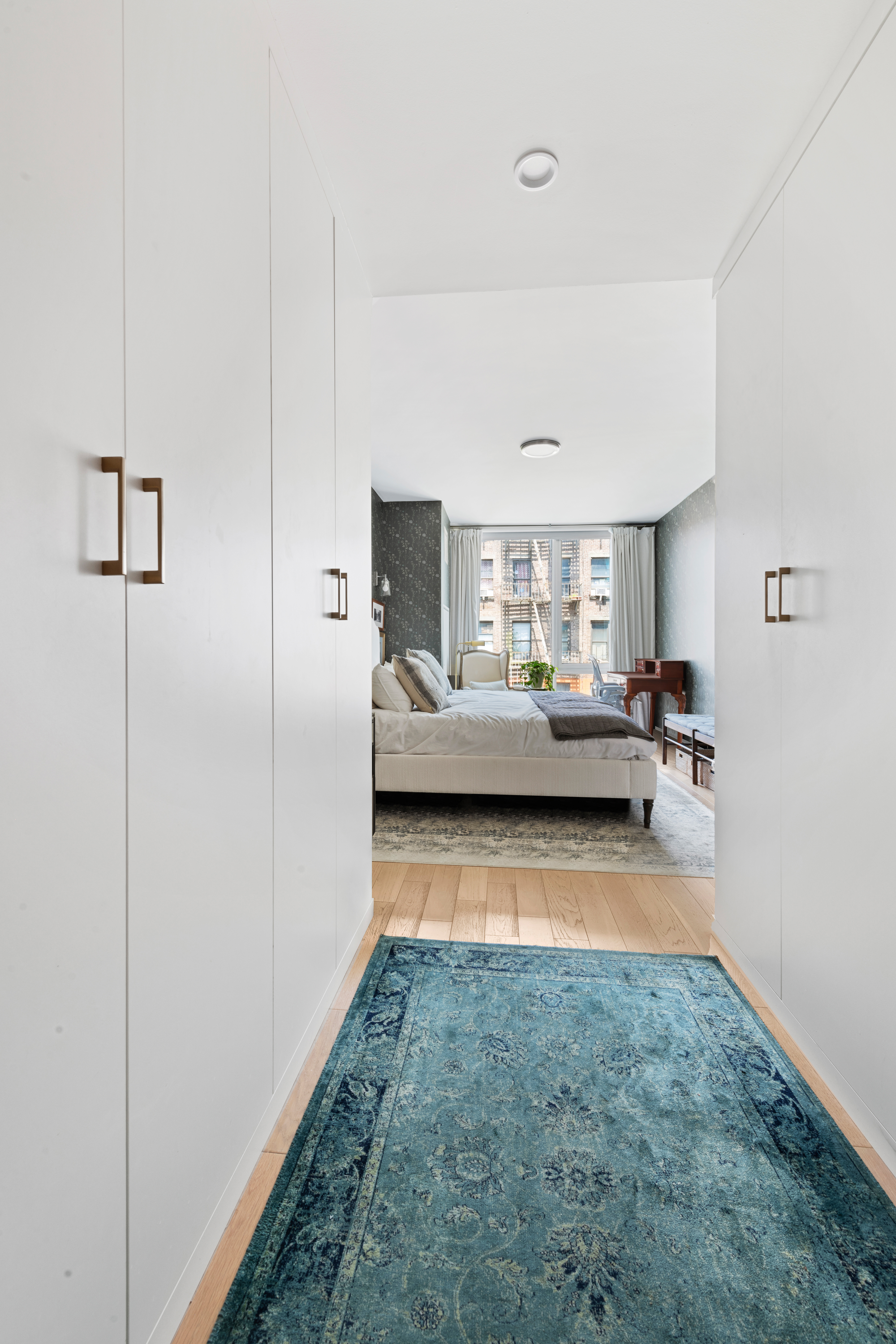 540 West 49th Street, Unit 401S Manhattan, NY 10019 - Photo 7 of 14 a view of living room with furniture and a gate